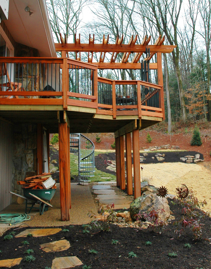 Elegant wooden deck and stone features beneath. 